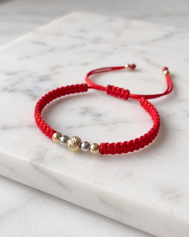 BRAZALETE 2 TONOS CON BALIN DIAMANTADO ROJO